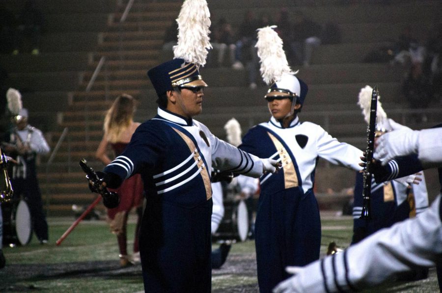 Zydrix Buse (9, left) and Niko Cayetano (11, right) prepare to perform during the halftime show.