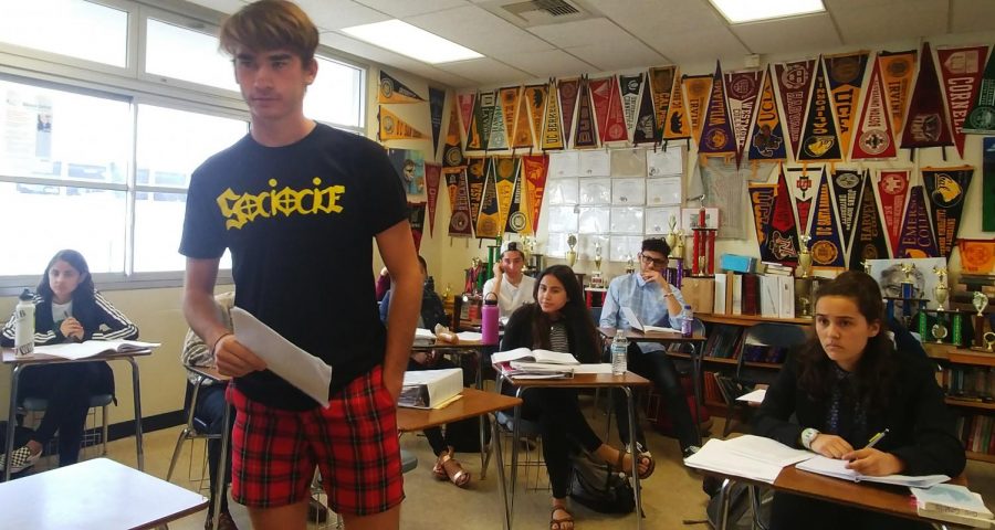 Senior John Clamon acts as defense attorney during an IB English Literature HL group project.  