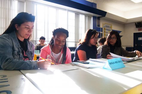 MSTI tutors Zahira Chayeb and Miriam Maldonado work with BVH students
at a TEAM tutoring session. TEAM tutoring meets after school in the cafeteria.
