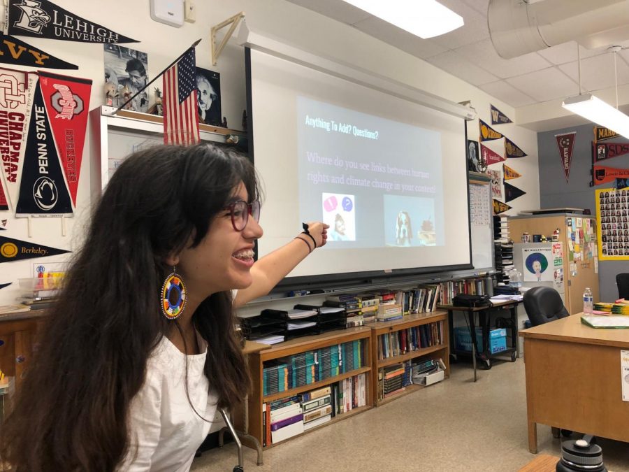 Junior Alicia Verdugo laughs as she addresses questions asked by the members for Amnesty International in room 211. Verdugo currently acts as president of Amnesty International.