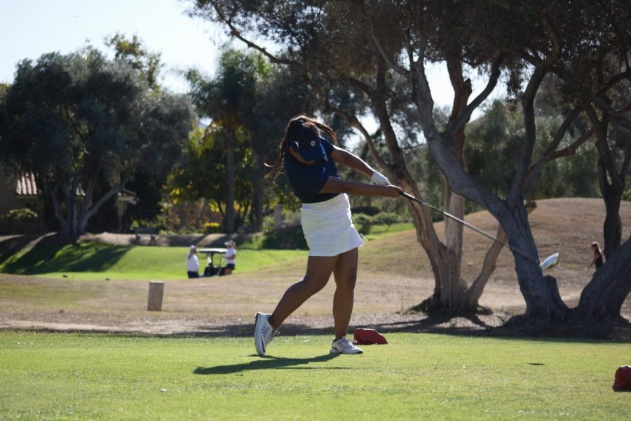Junior and girls golf captain Hannah Cancel strikes the ball at the 13th hole at the Sycuan golf course on Thursday Oct. 24th. Cancel was in the 3rd group with three other girls from Eastlake High School, Otay Ranch High School and Mater Dei Catholic High School.