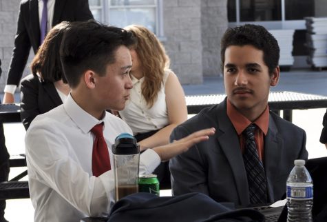 Juniors Sammy Elliot (left) and Kevin Soto (right) discuss the Lincoln Douglas debate topic “states ought to eliminate their nuclear arsenals”. They sat down during a break between rounds during the 3B tournament at Westview High School on Feb. 1, 2020.