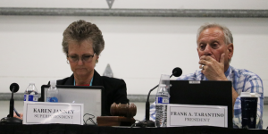 Karen Janney, Ed.D (left) sits next to former Board of Trustees President Frank Tarantino while a speaker addressed the Board on February 24. Janney was placed on paid administrative leave on June 24, after which Tarantino stepped down as president.