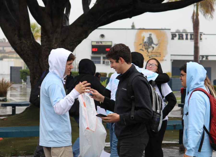 Associated Student Body (ASB) Secretary candidate, eventual winner and junior Noah Zelaya (left) greets potential voters in the BVH quad. Several candidates passed out trinkets or candy during their campaigns.