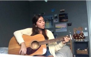Madison Geering plays the guitar and sings Underneath Your Clothes by Shakira. To her, this song represents loving others for who they truly are. 
