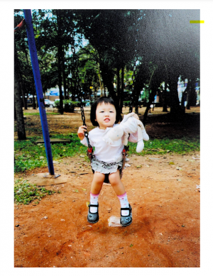 In 2007, Yealin Lee is on a swing with her plush doll, Kimchi. She brought Kimchi wherever she went.