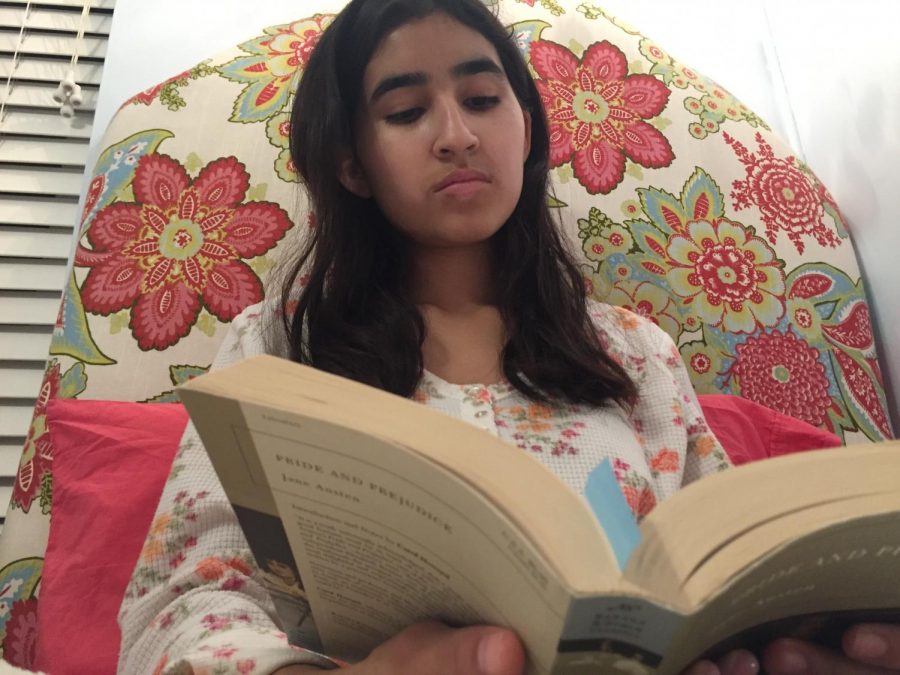 Pickwick Club co-President sophomore Giselle Geering reading Pride and Prejudice by Jane Austen before going to sleep.
Geering is reading in preparation for the next Pickwick Club meeting. The club meets on Mondays at 12:20pm.