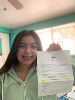 Junior Mia Gonzalez poses with a letter received from the Carson Scholars Fund. She received news of her win in March 2021 after applying in January.