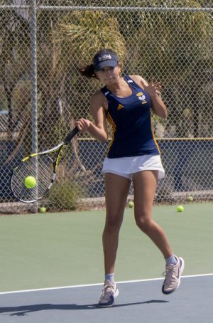 Junior Bibiana Martinez strikes the ball sideways towards her opponents. Martinez won 1st place in girls doubles at the tournament. 