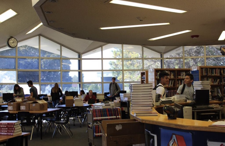 Prior to COVID-19, students fill the Bonita Vista High library on a school day. Students will now have access to library content online. 