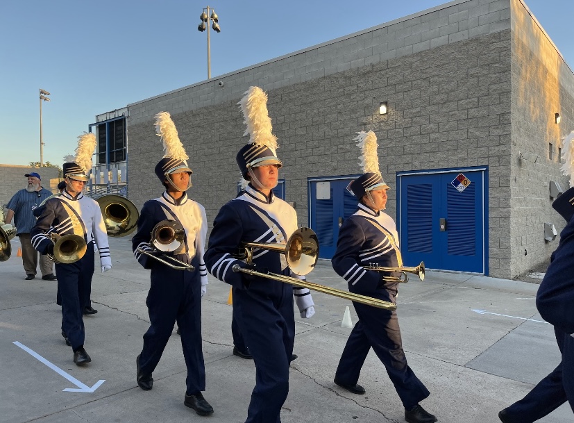 Club Blue members (left to right) Michael Mansfield, Jason Chaing, Madelyn Omelina and Alicia Chaidez follow after the line of their fellow members. They are getting prepared for their first performance since before the pandemic.