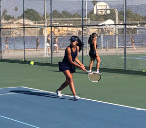 Captain and senior Alexa Fakhimi uses a backhand swing to hit the lower ball. On October 5th 2021 BVH beats Eastlake at the Tennis Courts of BVH.