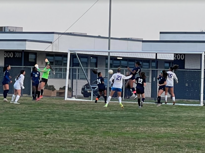 Goal keeper and senior Sabrina Ibanez keeps the ball out, while co-captain, defender and senior Jada Gibson goes in to prevent the Titans from scoring. This was the closest time Eastlake almost scored in the first half of the game. 