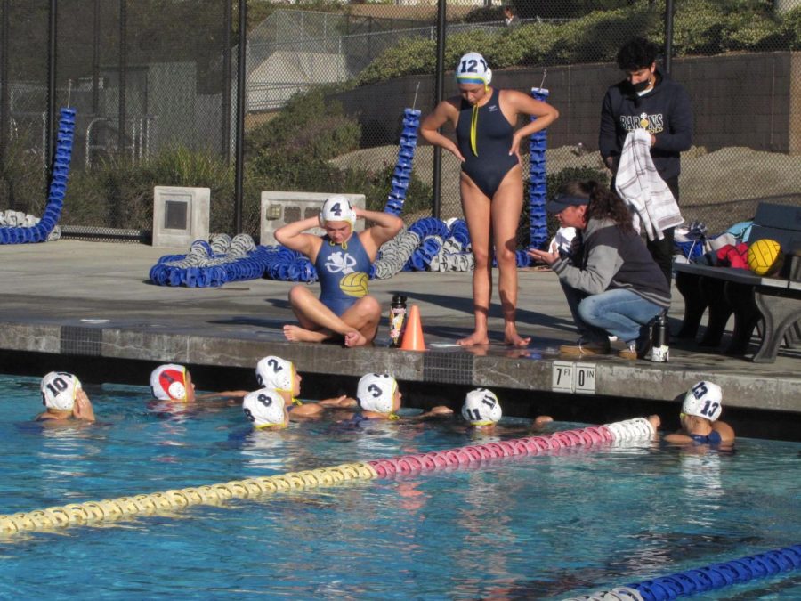 BVHs+girls+water+polo+team+comes+together+to+strategize+for+a+tournament+game+on+Jan.+22.+The+team+brought+up+JV+players+to+replace+three+of+their+starters+who+were+out+due+to+Covid-19.