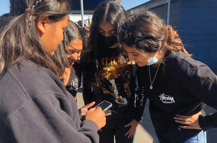 Associated Student Body (ASB) Secretary and senior Samantha Bianes shares a TikTok video with fellow ASB members during lunch. ASB often gets inspiration for spirit days from TikTok. 