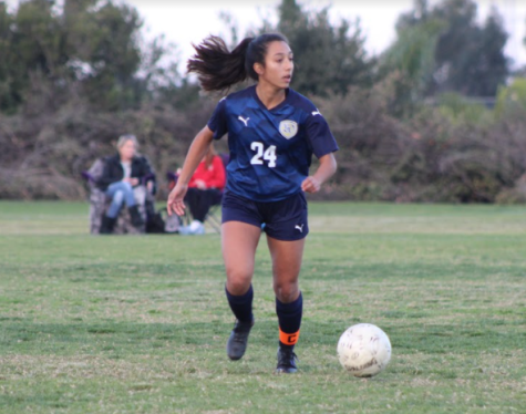 Co-captain and midfielder and senior Ashley Escamilla gains control of the ball and tries to advance to the goal. She is currently looking for players she is able to pass the ball to