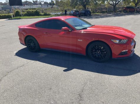 BVH student Kristopher Belladeres’ red 2015 Mustang in the parking lot in front of
the gym. It is one of the few cars from his fathers collection.