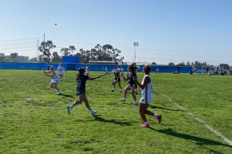 Defender and sophomore Francine Imperial (15) runs with the ball. She passes to Attack and sophomore Malia Garcia (13) the ball just before their fifth goal.