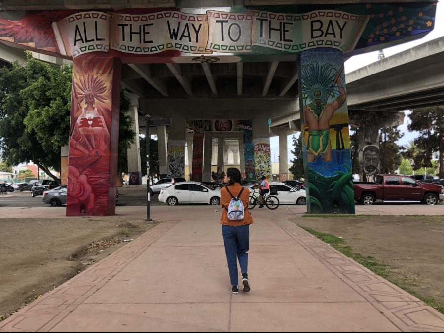 Ethnic Studies student walks under mural in Chicano Park after being told to explore the area for 45 minutes. She continues to walk around looking at the murals displayed in the park under the Coronado Bridge Highway. 