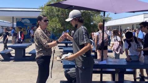 As lunch ends on Aug. 16, Patricia Perez goes around to make sure students pick up their trash before they leave to class. She gives students a coupon to get a free ice cream at ASB after they picked up trash. 