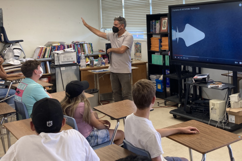 On Aug 2 in room 35, Spanish and French teacher Patrick Beaulieu plays his French 5/6 class a song. The students pay attention as the video begins to play.