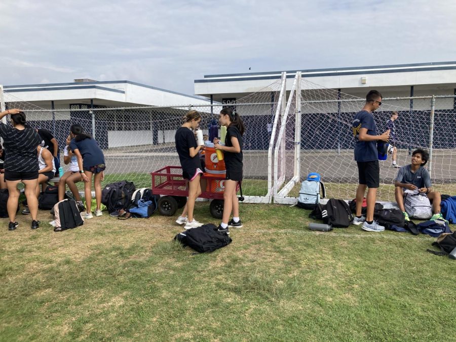 Before embarking on their daily routine and running, the Cross country team takes a water break to hydrate after a warm-up. This team like others such as football, and tennis takes precautions against the excessive heat but, as usual practices continue Monday September 12 at Bonita Vista Field. https://bonitavistacrusader.org/staff_name/william-maywood/