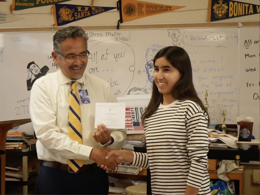On+Oct.+28%2C+BVH+Interim+Principal+Lee+Romero+visited+room+703+to+give+senior+Giselle+Geering+a+letter+of+commendation.+Students+in+703+begin+to+cheer+as+Romero+explains+what+the+letter+contained.