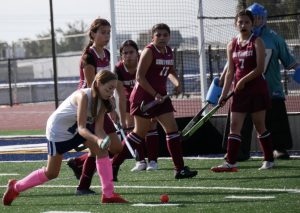 On Oct. 10 at Bonita Vista High (BVH), forward and freshman, Ella Roberts swings to hit the ball into the goal against Southwest High (SOH) in the first quarter. The final score was 4-0, making it the third win for the girls field hockey team.
