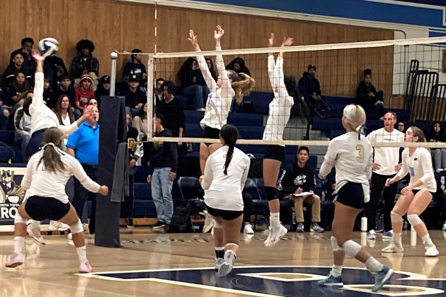 Bonita Vista High girls varsity volleyball Opposite Hitter Abby Topete (18) hits the ball towards the Pacific Ridge varsity girls volleyball team. As the third set finishes, the crowd grows eager for a win on the road to CIF.