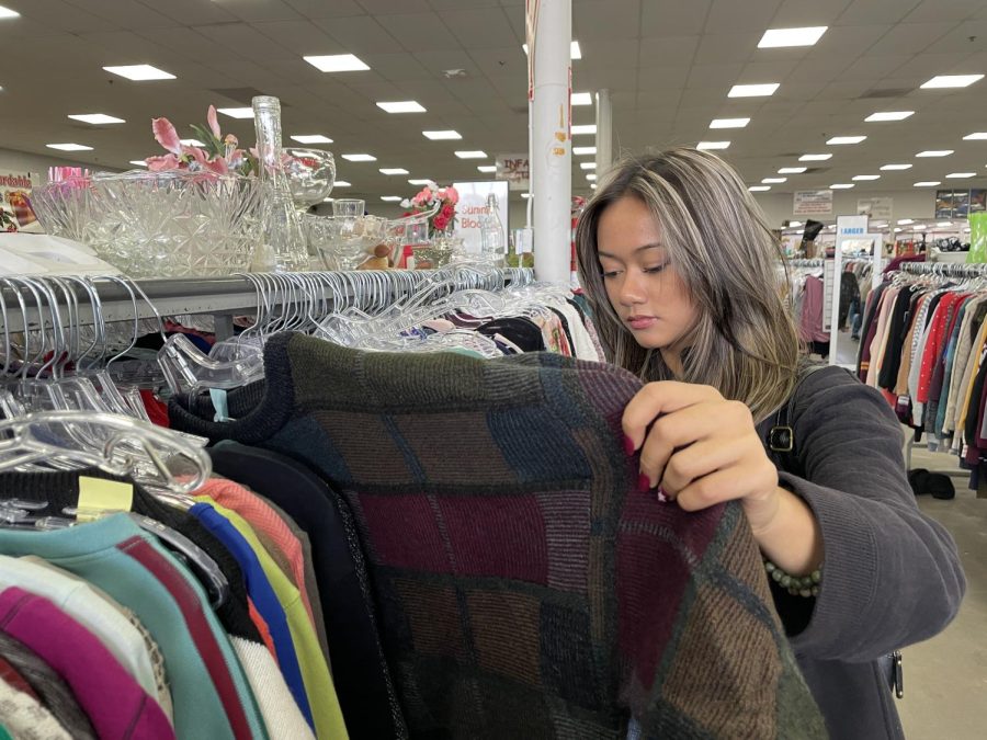 Junior Merseis Marinelli shops at Veterans thrift store, one of the many thrift stores she buys from and donates to. She goes thrifting with her friends. 