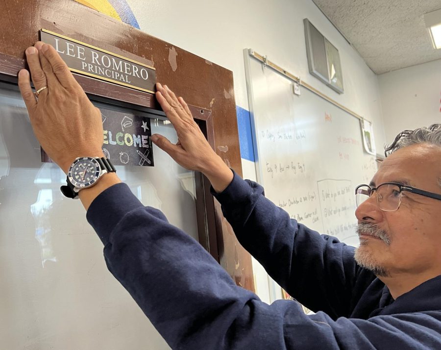 On December 2nd BVH principal Lee Romero installs the new nameplate on his office door. 