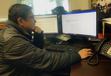 Attendance Coordinator, Chemistry teacher and Restorative Specialist at Bonita Vista High (BVH) Antonio Gutierrez checks
the daily attendance in his office.