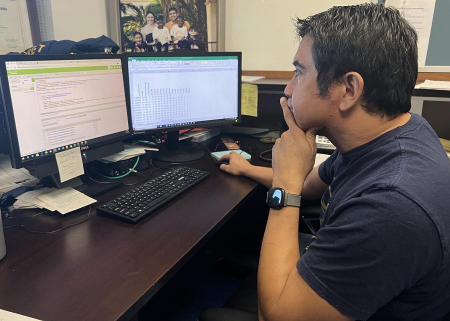 On November 28, Attendance coordinator Antonio Gutierrez updates the daily attendance sheet as part of his many tasks as attendance coordinator.