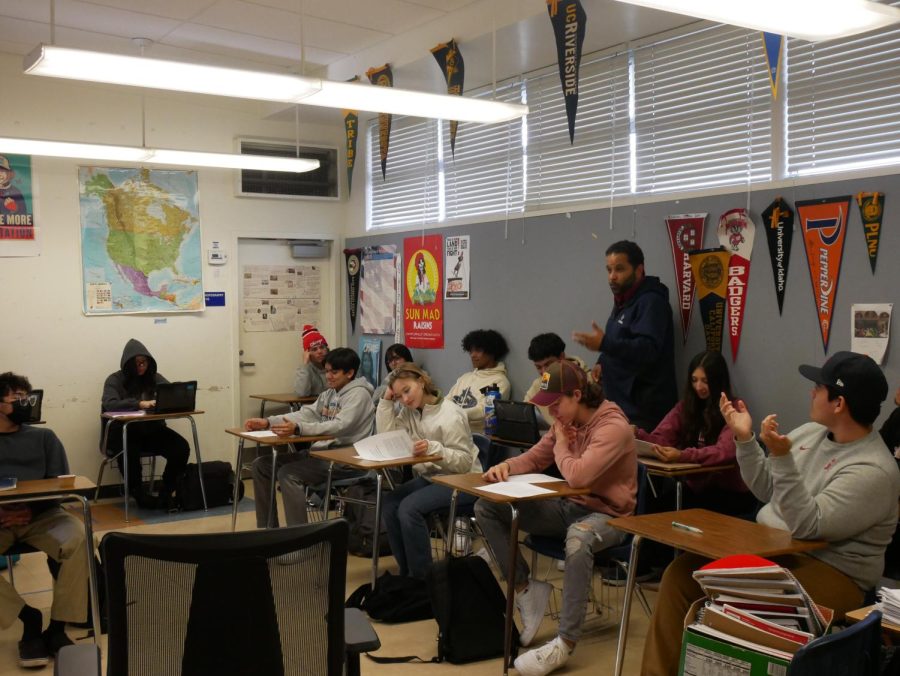 On Dec. 12, BVH Ethnic Studies, Black Student Union (BSU) advisor and boys basketball Head Coach Do Dumas talks to his fifth period AP class. He discusses about the history of african-american voting history.