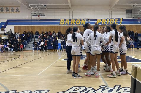On Jan. 18, captain, point guard and senior Kaylyn Buchanon-Lamb (3) hit her 1,000th career point at a home game against Otay Ranch High (ORH). Buchanon-Lamb and her team call a timeout in the first quarter to celebrate her milestone.