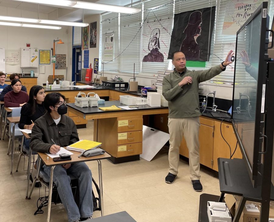 Chemistry Honors, AP Chemistry, and IB Chemistry teacher Jeff Rivera teaching his fourth period AP/IB Chemistry classes. As a result of low student enrollment, there are no other periods with AP or IB Chemistry other than this one period.