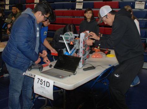 At Montgomery High on Jan. 28, Bonita Vista High (BVH) competes in Montgomery High’s Eighth Annual Tournament for Robotics. BVH’s team 751D works together to repair their robot following their first match.