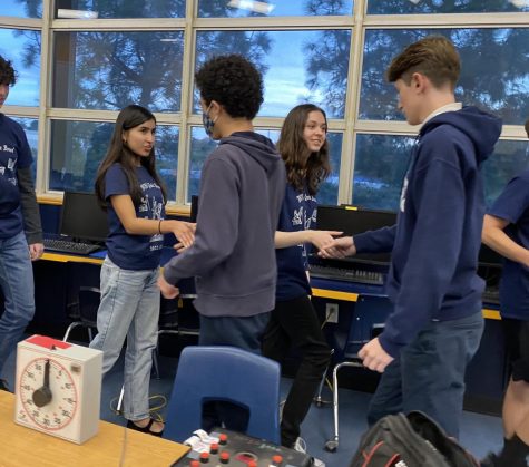 Members of the Bonita Vista High (BVH) Quiz Bowl shake hands with Mater Dei Quiz Bowl members after a their first match of the year. BVH took a loss of 185-335.