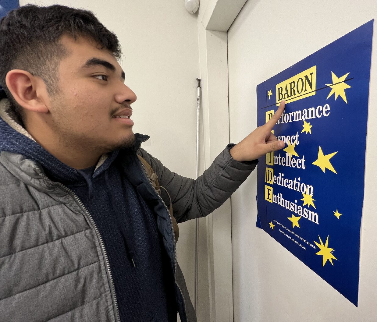 At Bonita Vista High (BVH)  throughout the classrooms there are BARON PRIDE posters around. On Jan. 30, BVH junior Miguel Rodriguez inspects the old Baron Way poster.