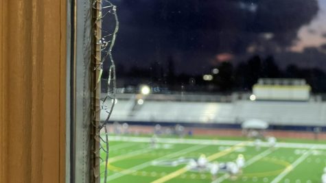 On March 2, a broken window looks from inside the home out on to the new BVH field. This window was broken by a rock thrown from the visitors side of the field, residents surrounding the area are infuriated by the conditions that BVH’s field has brought to them