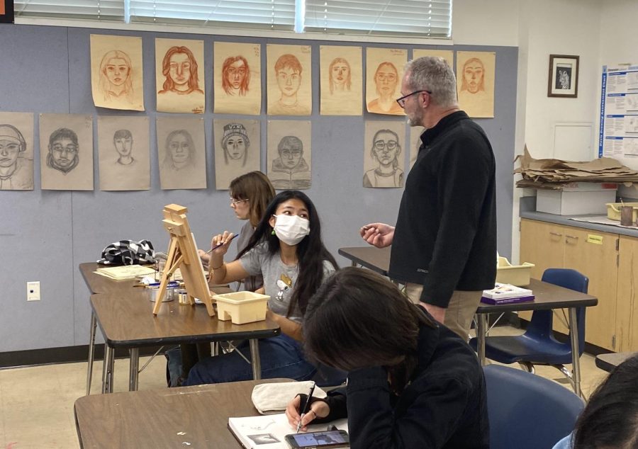 Beginning art, advanced art and Advanced Placement (AP) drawing teacher Nicolas Braunn checks AP drawing students progress on art work. This six period class has two classes in one which is AP drawing on one side of the classroom and Advanced art on the other side.