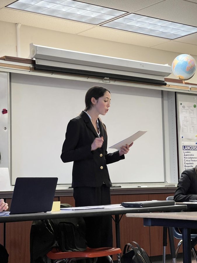 Sophomore and Speech and Debate historian Morgan Murphy gives a speech laying out her team’s arguments. The topic they were debating was Resolved: In the United States, right to work laws do more harm than good.