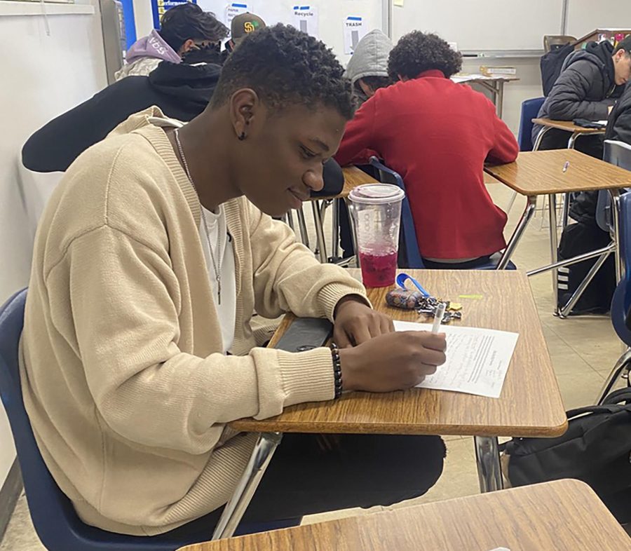 On Feb. 23, Gladney works on an assignment in his first period English 12 class in room 405. Gladneys assignment is to work with a select group and to write a new ending to the book Into the Wild. 