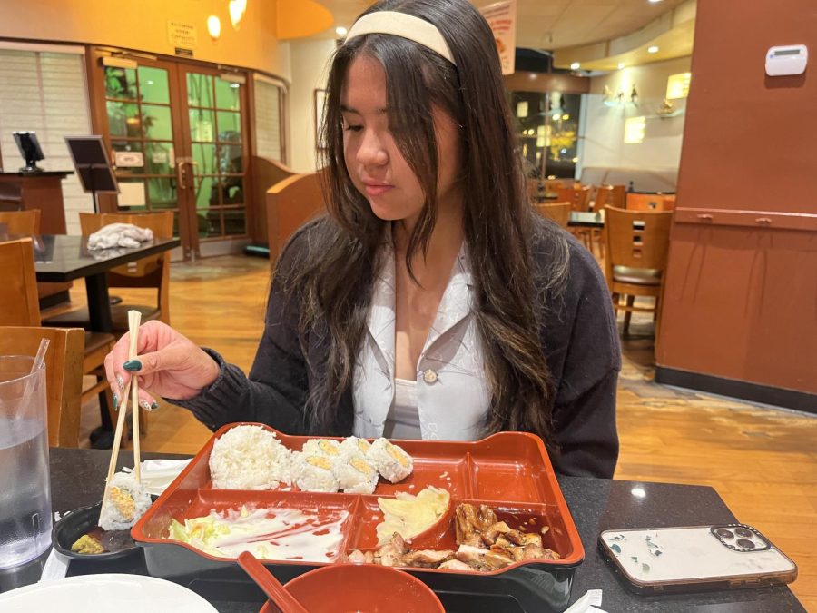 On Tuesday night, May 9, senior Lannah Garcia eats a two-item Pick and Mix Bento at China Bento at Terra Nova Plaza. The meal for her specifically cost around $15.00.