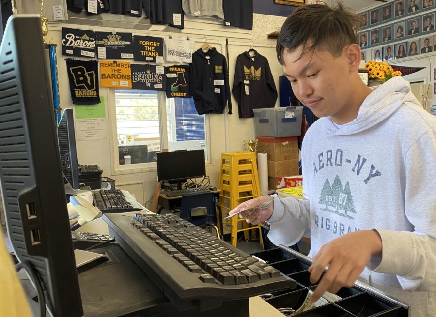 On May 8, financial commissioner of Bonita Vista High (BVH)s Associated Student Body (ASB) Kian Torres is seen working in the ASB. He is given money from a student trying to buy the yearbook.