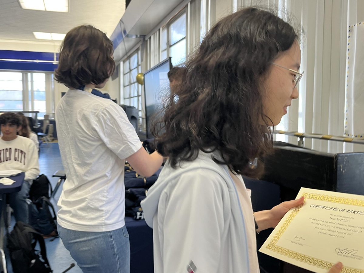 During the closing ceremony on Aug. 11, Honoka Hibino receives her certificate for completing the program at Bonita Vista High, as her host Vivien Pruitt receives a BVH Baron T-shirt to hand to Hibino. Hibino and Pruitt shares a unique bond, as they were able to communicate without the need to utlilize Google to translate. 