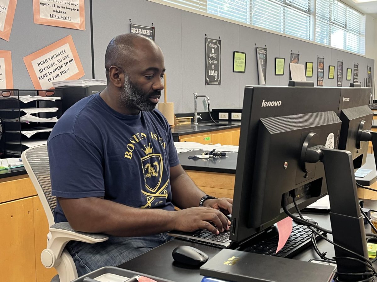 Chemistry teacher and girls volleyball Head coach Ahmad Rice responds to emails during his resource period. Rice has officially taken the role as girls lacrosse Head coach at Bonita Vista High.