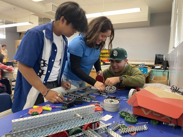 On Sept. 20, robotic members and seniors Matthew Ecdao, Erica Palacios and Jonathan Enriquez (left to right) are seen building the foundation of their robot. Members in the club gathered in room 210 after school to work on their projects.