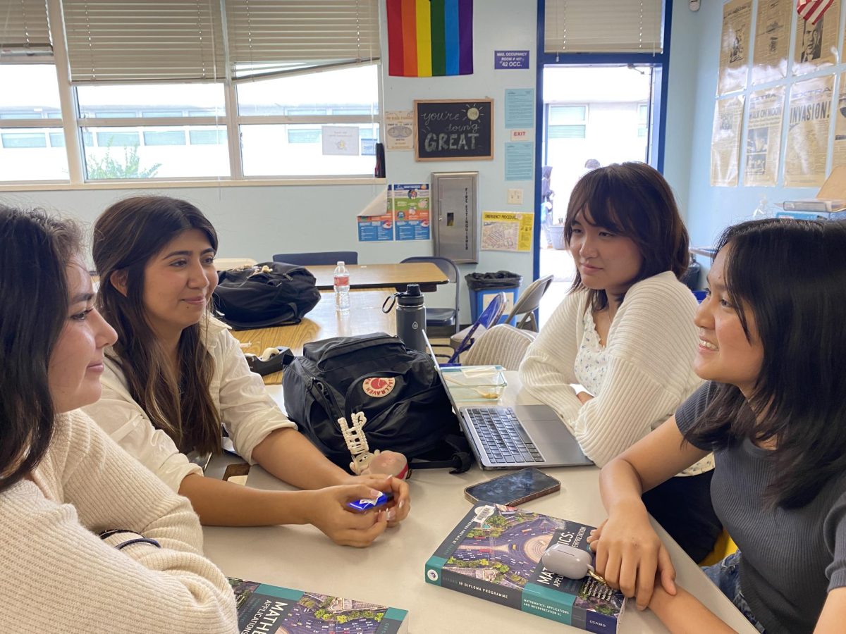 International Baccalaureate (IB) Diploma Program senior Alexis Acosta sits with other IB senior students, Nicolette Luna, Grace De León and Cherise Magtoto at Bonita Vista High (BVH).  The IB Diploma candidates discusses the IB program and the students involved this school year.