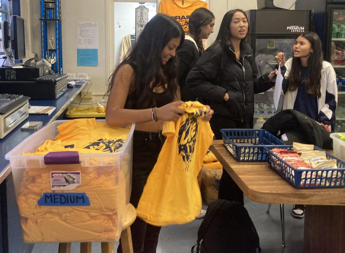 Throughout the week of Oct. 23 BVHs Associated Student Body released Drain the Lake shirts for the upcoming BVH and Eastlake football game. ASB Vice President Malyna Castillo glimpses at the shirts tag sizes for fellow BVH customers